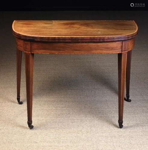 A George III Inlaid Mahogany Games Table.