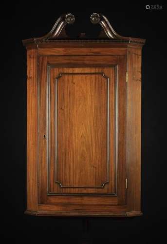 A Georgian Mahogany Corner Cupboard.