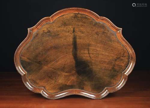 A George II Mahogany Cartouche Tray with raised moulding to the serpentine edge,