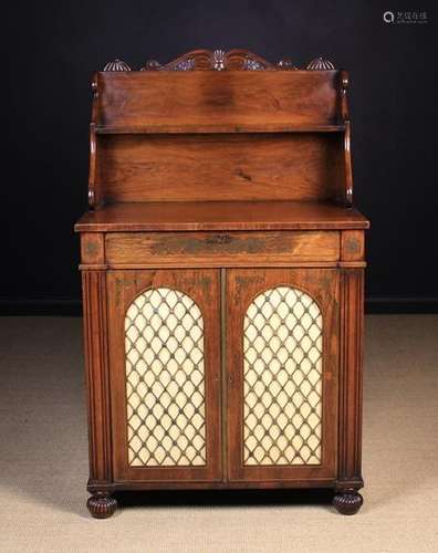 A Fine Quality Regency Rosewood Chiffonier inlaid with scrolling brass embellishments and stringing.