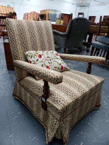 A VICTORIAN LOW OPEN ARMCHAIR WITH TURNED WALNUT FORELEGS.