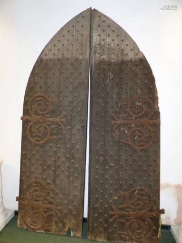 AN IMPRESSIVE PAIR OF 19th.C.GOTHIC TOP CHURCH DOORS WITH IRON STUDWORK AND SCROLLING WROUGHT IRON