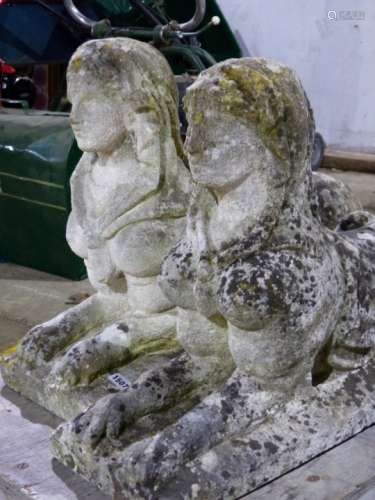A PAIR OF ANTIQUE WEATHERED STONE FIGURES OF RECUMBENT SPHINX. L.77cms