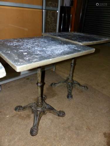 A PAIR OF VINTAGE CAFE TABLES WITH CAST IRON BASES AND ZINC WRAPPED PINE TOPS. 59 x 59 x H.73cms.
