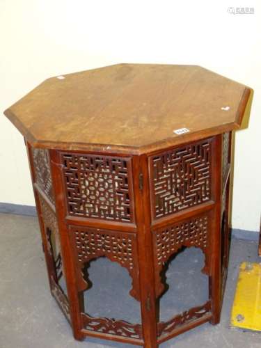 A HARDWOOD EASTERN MOORISH STYLE OCTAGONAL TABLE WITH PIERCED DECORATION. W.60 x H.62cms.