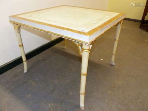 A GILT AND WHITE PAINTED COFFEE TABLE, THE TOP GLAZED OVER A ROUNDEL OF FLOWERS PAINTED ONTO A WHITE