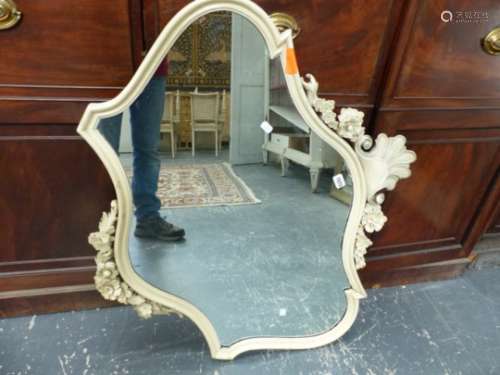 AN ANTIQUE SHAPED FRAME WALL MIRROR WITH CARVED CREST. 96 x 82cms.