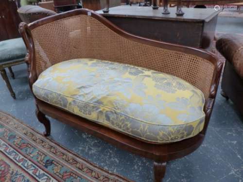 A GOOD QUALITY FRENCH STYLE HARDWOOD AND CANED SMALL CHAISE LONGUE WITH SWAN FORM ARMS AND FEATHER