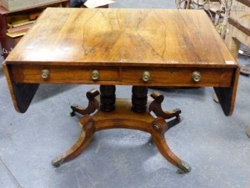 A REGENCY ROSEWOOD SOFA TABLE ON TWIN TURNED SUPPORTS OVER PLATFORM AND QUADRUPED SABRE LEGS WITH
