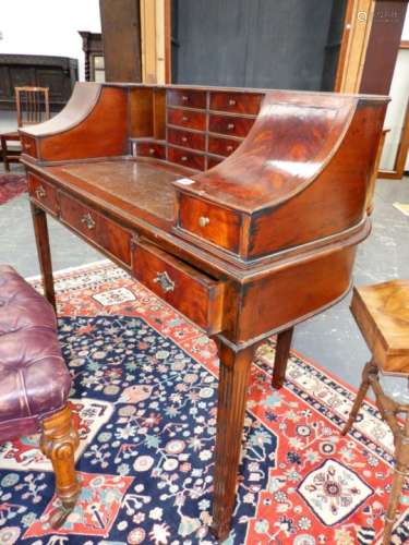 A BESPOKE MAHOGANY CARLTON HOUSE WRITING DESK OF TRADITIONAL FORM ON FLUTED SQUARE TAPERED LEGS. 120