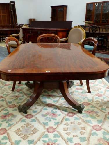 AN EARLY 19th.C. CROSS BANDED MAHOGANY BREAKFAST TABLE, THE ROUNDED RECTANGULAR TOP ON BALUSTER