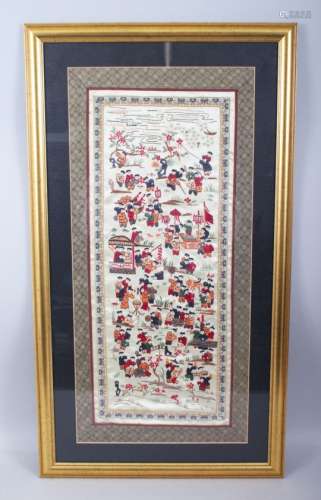 A LATE 19TH / EARLY 20TH CENTURY CHINESE EMBROIDERED SILK OF BOYS, the framed silk work depicting