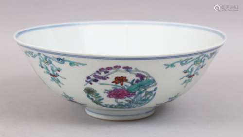 A LARGE CHINESE DOUCAI PORCELAIN BOWL, decorated with panels of foliage, the base with a six