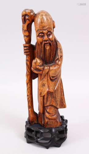 A GOOD 18TH CENTURY CHINESE BOXWOOD CARVED FIGURE OF SHOU LOU, stood bearing his staff and gourd