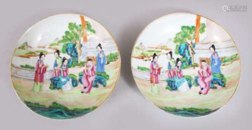 A PAIR OF 18TH CENTURY CHINESE FAMILLE ROSE PORCELAIN SAUCERS, decorated with figures in landscapes,