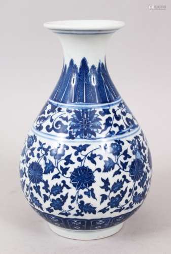 A GOOD CHINESE MING STYLE BLUE & WHITE PORCELAIN BOTTLE VASE, decorated with formal scrolling