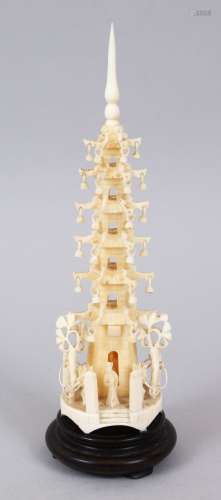 A GOOD 19TH CENTURY CHINESE CARVBED IVORY PAGODA FIGURE, on its hardwood base, 20cm high overall x