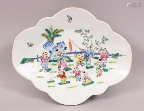 A 20TH CENTURY CHINESE FAMILLE ROSE PORCELAIN FOOTED DISH, the dish decorated with scenes of boys