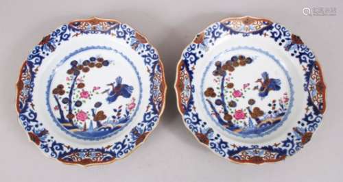 A PAIR OF QIANLONG ENAMEL DECORATED PORCELAIN SOUP PLATES, decorated with scenes of birds amongst