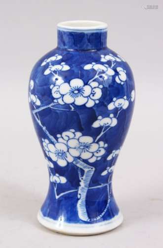 A 19TH CENTURY CHINESE BLUE & WHITE PORCELAIN PRUNUS VASE, the base with a four character kangxi