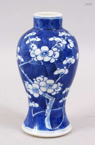 A 19TH CENTURY CHINESE BLUE & WHITE PORCELAIN PRUNUS VASE, the base with a four character kangxi