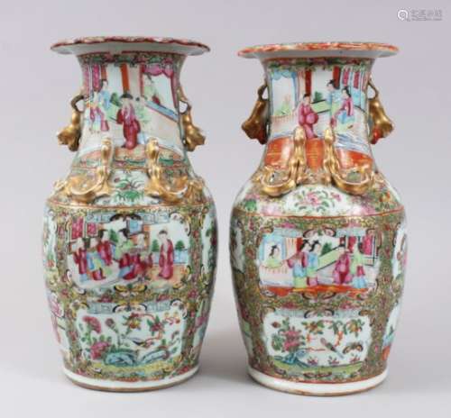 A PAIR OF 19TH CENTURY CHINESE CANTON FAMILLE ROSE VASES, decorated with panels of figures within