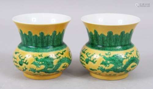 A GOOD PAIR OF CHINESE YELLOW GROUND FAMILLE VERTE PORCELAIN DRAGON BOWLS, the exterior decorated