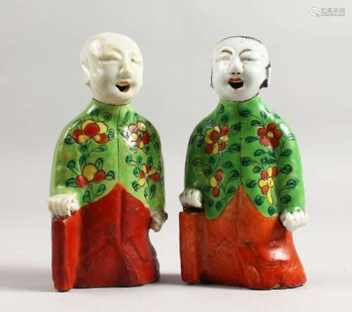 A GOOD PAIR OF 18TH CENTURY CHINESE FAMILLE ROSE FIGURES of boys, three quarter length. 6ins high.