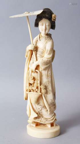 A GOOD JAPANESE MEIJI PERIOD CARVED IVORY OKIMONO OF A GEISHA GIRL, stood holding an umbrella and