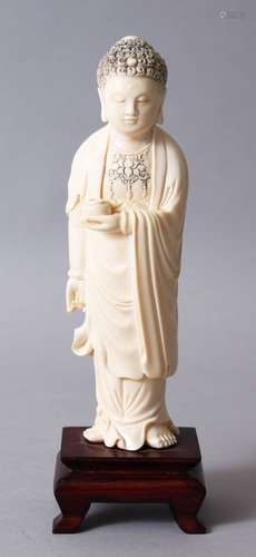 A GOOD 19TH CENTURY CHINESE CARVED IVORY FIGURE OF BUDDHA, stood upon a hardwood stand, holding a