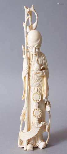 A GOOD 19TH CENTURY CHINESE CARVED IVORY FIGURE OF SHOU LOU, stood houlding a gourd and his staff,