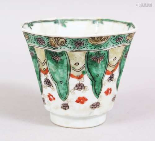 A GOOD CHINESE OCTAGONAL KANGXI PERIOD FAMILLE VERTE PORCELAIN WINE CUP, with lappet style