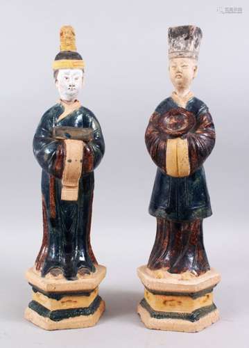 A PAIR OF CHINESE MING STYLE SANCAI POTTERY TOMB FIGURES, the figures stood on hexagonal form