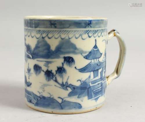 A 19TH CENTURY CHINESE BLUE AND WHITE PORCELAIN MUG with a lake scene. 3.5ins high.