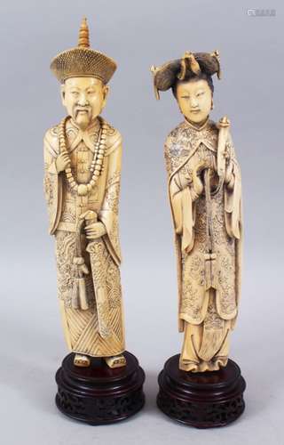 A PAIR OF 19TH CENTURY CHINESE CARVED IVORY EMPEROR AND EMPRESS FIGURES, the emperor stood in