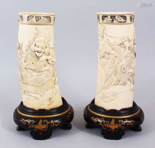 A GOOD PAIR OF JAPANESE MEIJI PERIOD CARVED IVORY TUSK VASES - SEVEN LUCKY GODS, the body of the