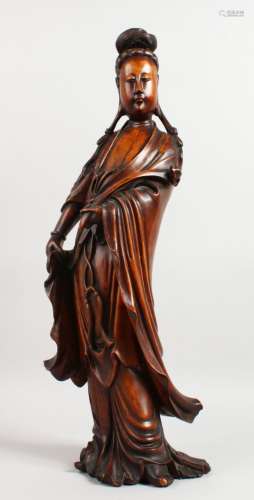 A SUPERB 19TH CENTURY CHINESE CARVED WOOD FIGURE OF GUANYIN holding a sceptre. 22ins high.