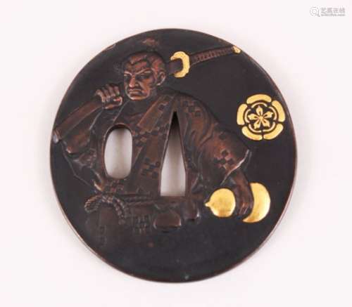 A JAPANESE MEIJI PERIOD BRONZE & MIXED METAL TSUBA OF A SAMURAI, the front of the tsuba with a