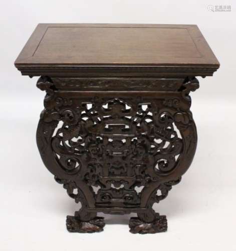 A 19TH / 20TH CENTURY CHINESE HARDWOOD ALTER TABLE, the front carved and pierced with scholars