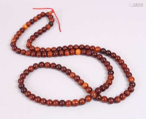 A SET OF CHINESE HORN ROSARY BEADS, consisting of 109 round beads, each approximately measuring 1.