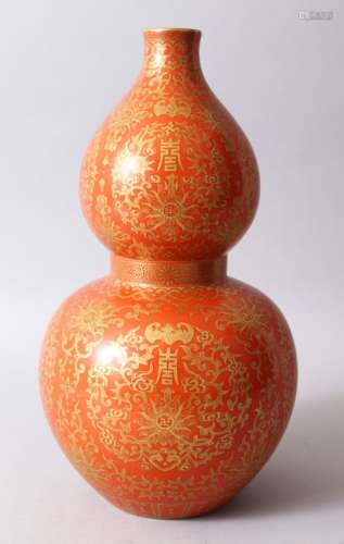 A GOOD CHINESE CORAL GROUND AND GILDED DOUBLE GOURD PORCELAIN VASE, The body of the vase decorated
