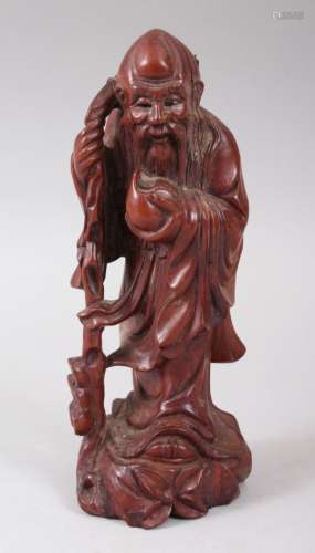 A LATE 19TH CENTURY CHINESE CARVED HARDWOOD FIGURE OF SHOU LOU, holding his staff and a gourd,