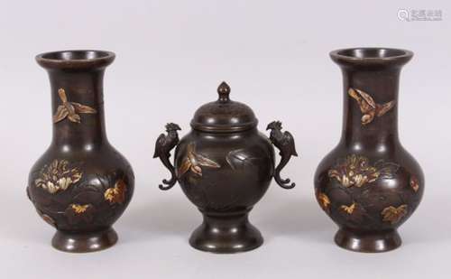 A GOOD GARNITURE OF JAPANESE BRONZE AND MIXED METAL, consisting of a pair of vases and a koro, all