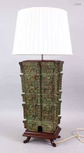 A 20TH CENTURY CHINESE ARCHAIC STYLE BRONZE LAMP, The body of the vase decorated with archaic