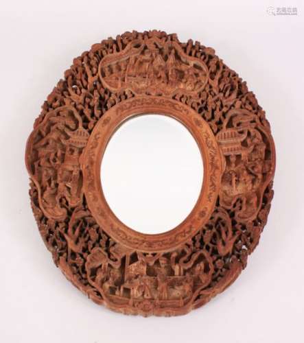 A GOOD 19TH CENTURY CHINESE CANTON CARVED SANDALWOOD MIRROR, the frame of the mirror with four