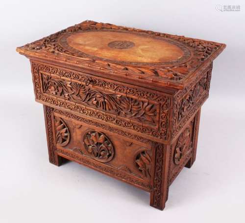 AN 18TH / 19TH CENTURY INDIAN KASHMIR FOLDING WOOD MERCHANTS DESK, carved in deep relief to depict