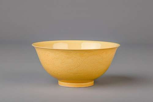 A Chinese yellow ground bowl with incised underglaze