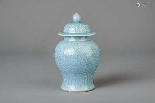 A Chinese monochrome blue vase and cover with incised