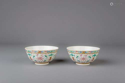 A pair of Chinese famille rose bowls with flowers and