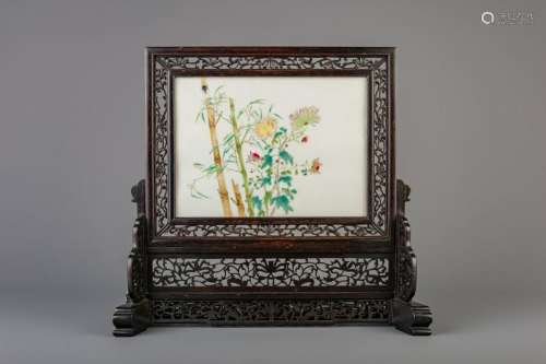 A Chinese table screen with a famille rose plaque,